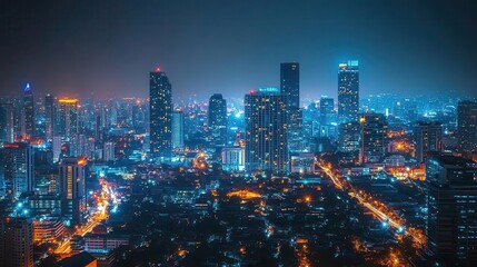 Fototapeta premium Urban skyline at night, city lights twinkling, tall buildings glowing against the dark sky, sense of energy and vibrancy