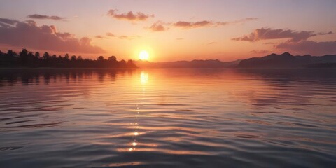 Obraz premium Softly fading sunset with ripples on the water surface, nature scenery, peaceful, dreamy