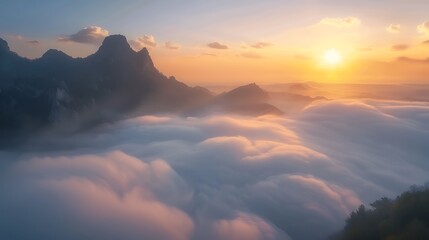 Breathtaking Sunrise Over Mountains with Soft Clouds and Mist Creating a Dreamy, Ethereal Landscape at Dawn in a Serene Environment