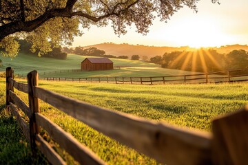Fototapeta premium Sunrise over serene farmland with a rustic barn and golden fields in tranquil countryside