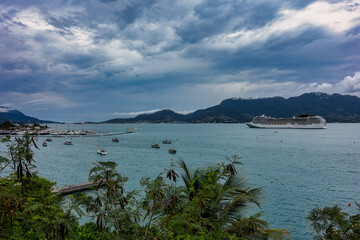 View of the Sao Sebastiao navigation channel in Sao Paulo, Brazil, with boats and ships on a cloudy day