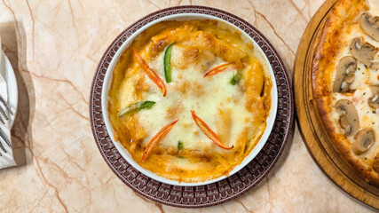 Oven baked pasta or baked creamy chicken pasta with mozzarella cheese 