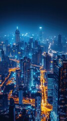 Fototapeta premium Breathtaking aerial view of a vibrant metropolitan city skyline at night with a dazzling array of illuminated high rise buildings and skyscrapers against a dark blue sky