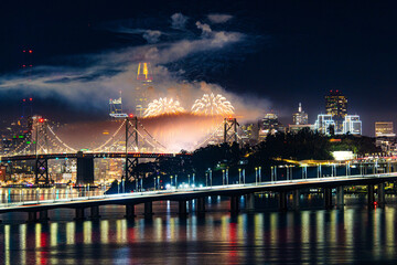 Fototapeta premium San Francisco Fireworks with cityscape in the back; Bay bridge and the whole San Francisco cityscape in the background in the new years