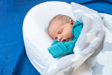Newborn baby, 4 days old, sleeping.
