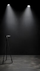Camera on tripod with lights against a dark background.