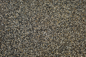Background texture of an exposed aggregate concrete surface for driveways and decorative paving....