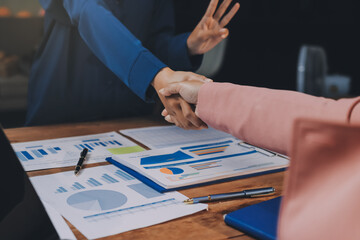 Business handshake for teamwork of business merger and acquisition,successful negotiate,hand shake,two businessman shake hand with partner to celebration partnership and business deal concept