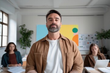 Obraz premium Mature teacher standing in classroom with students learning using laptop and books, modern education concept