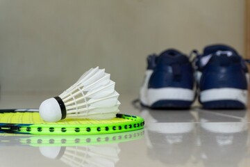 Badminton rackets, shuttlecocks and shoes. Concept of badminton equipment