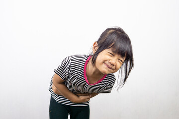 Portrait of little Asian girl posing on white background