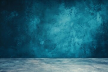 Blue wall in a minimalist room with concrete flooring and soft blurred elements 