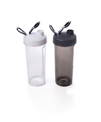 Translucent shakers placed on a white background, ideal for mixing beverages, showcasing a sleek and functional design for fitness enthusiasts and active lifestyles.