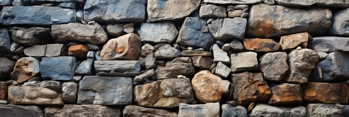 Raw stone wall texture in chaotic arrangement showcasing a blend of colors and natural patterns for architectural and artistic applications