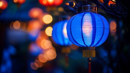 Asian traditional blue lantern hanging with festive bokeh light with copy space 
