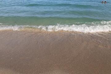 Sea waves on the beach coast with white sand