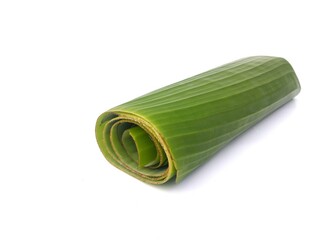 Banana leaf roll isolated on white background  © Eka