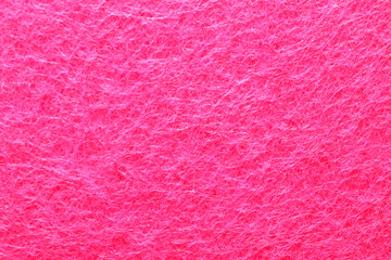 Pink felt background and texture, close-up.