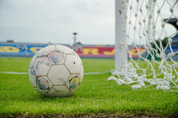 soccer ball in goal net