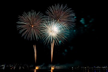 Festive Fireworks Display Over Night Cityscape