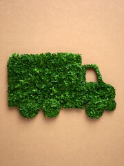  A truck made entirely of green leaves and plants, promoting eco-friendly transportation and sustainability.