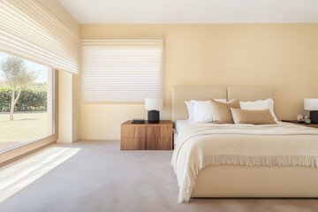 Fototapeta premium Bright and serene bedroom with modern decor and natural light during daytime