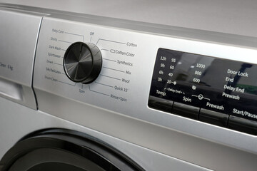 Close-up of the control panel of a modern washing machine.