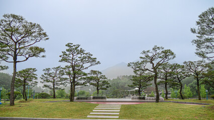 Hapcheon-gun, Gyeongsangnam-do, South Korea -  tourists are walking on dirt road besides Colonial Japanese House and clothes store at Hapcheon Film Theme Park Morning view of photo studio and shops fo