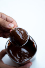 A strawberry in dark Belgian chocolate