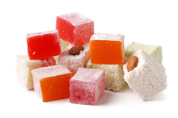 Colorful assortment of traditional Turkish delight with nuts displayed on a white background