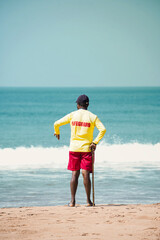 Life Gaurd standing on beach