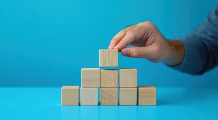 Progress Bar Transition from 2025 to 2025 with Wooden Blocks and Hand Placement