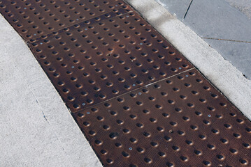 Manhole cover american made rusty grunge. Weathered street steel cover plate.