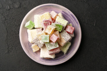 Colorful assortment of traditional Turkish delight on a decorative plate from a local market