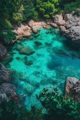 Obraz premium Aerial view of a calm bay with crystal-clear waters near the coast 