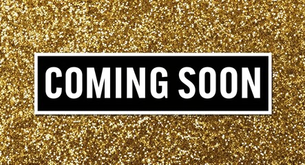 coming soon white text lettering on plain black background with gold glitters