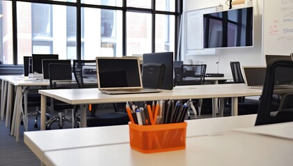 Laptop and computer on desk at office