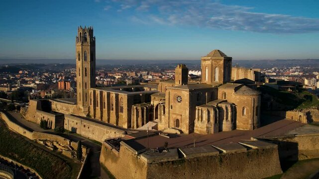 Majestic old cathedral on top of the hill and sorrounded by the city of Lleida in Catalonia, Spain. High quality 4k drone footage