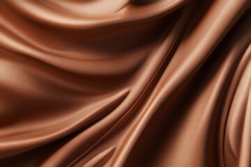 Fototapeta premium Close-up of silky brown fabric with flowing folds and a rich texture. Highlights mocha mousse as a luxurious and elegant color for textile and design inspiration.