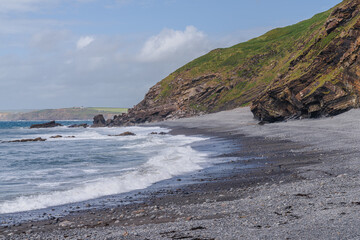 The cliffs and beach in Millook Haven, Cornwall, England, UK