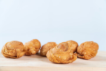 delicious curry puffs on wooden cutting board
