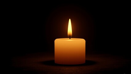Single candle burning in the dark
