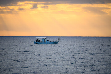 Obraz premium fishing boat in the sea