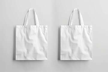 Two blank white tote bags on grey background.