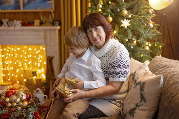 Happy family on Christmas, enjoying some quality time together, kids and adults with pet dog on Christmas eve