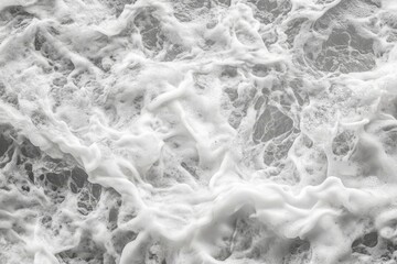 Obraz premium Close-up of churning ocean waves, white foam texture.