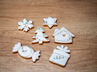 Sweet Christmas gingerbread cookies decorated by hand with beaten egg whites.