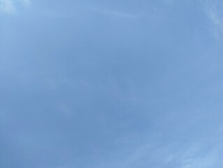Clear blue sky with thin cloud texture. Natural blue background 