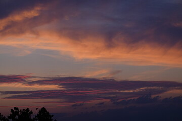 Naklejka premium Rose sunset and colorful clouds
