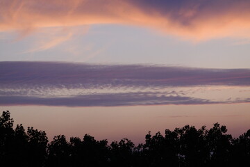 Obraz premium Rose sunset and colorful clouds